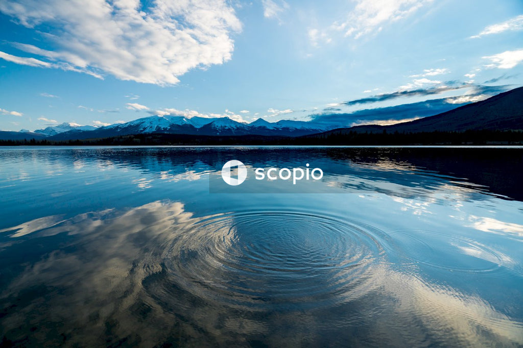 Body of water under blue sky