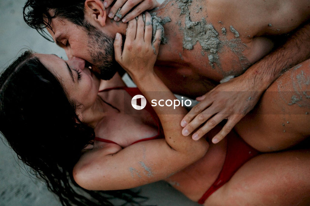Man and woman in swimsuit kissing