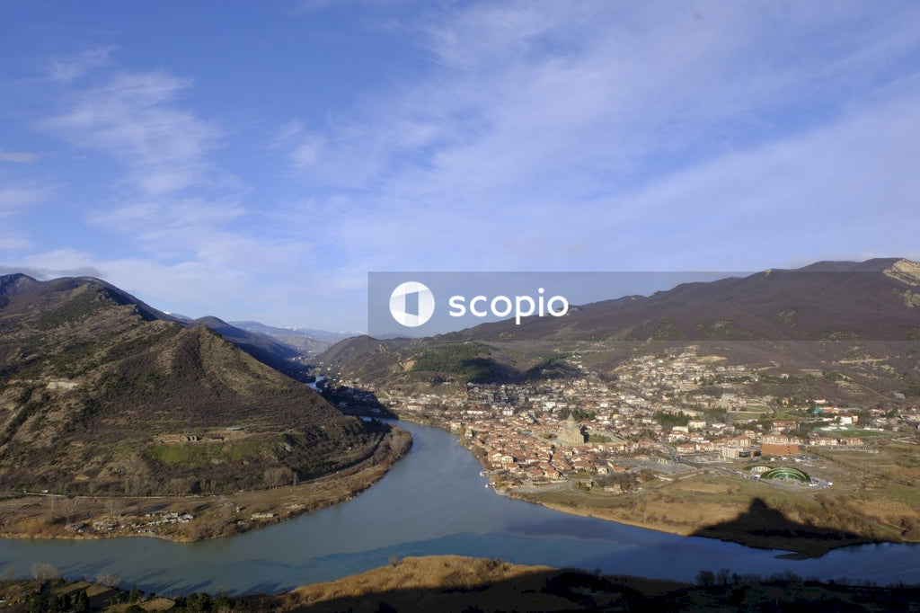 Aerial view of green mountains and river