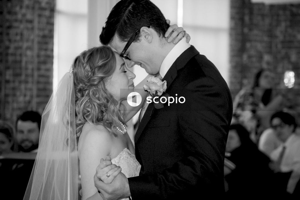 Grayscale photo of man and woman kissing