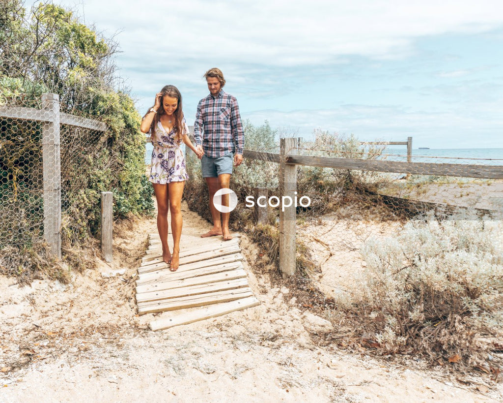 Man and woman standing on dockside