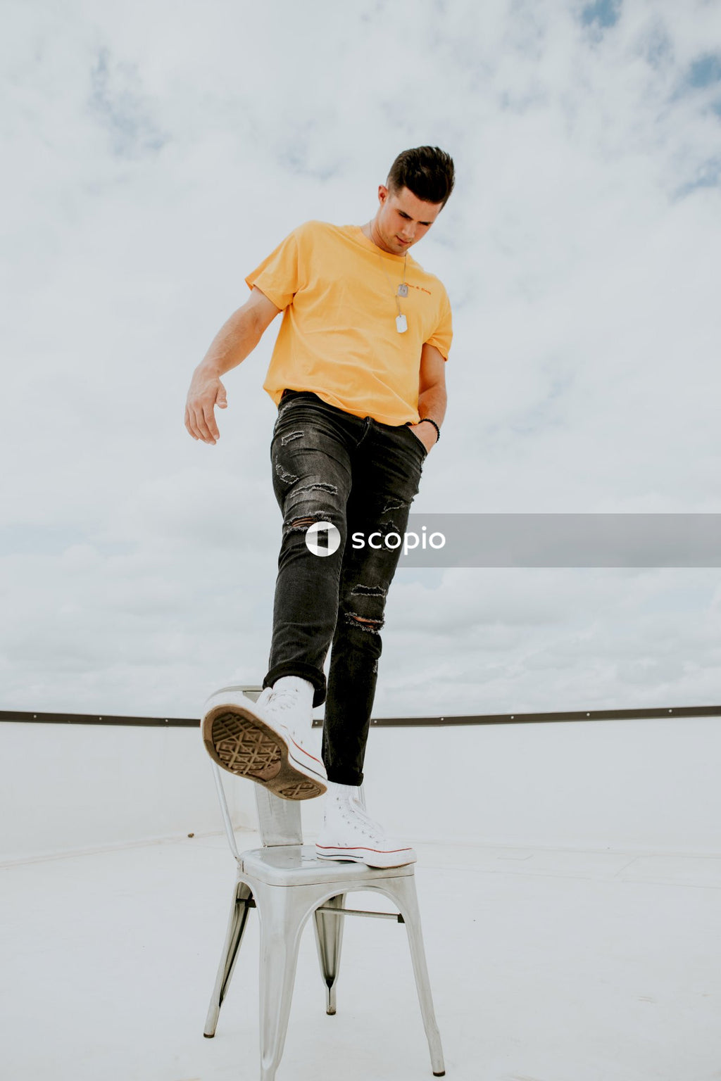 Boy stand on chair