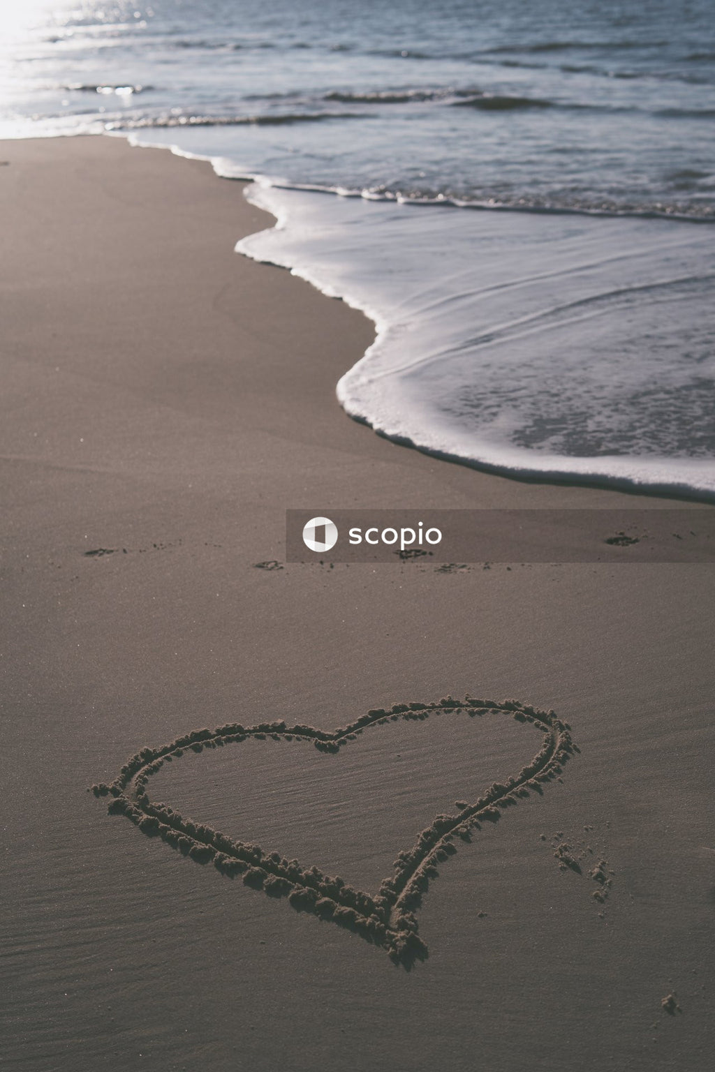 Heart shaped sand on beach
