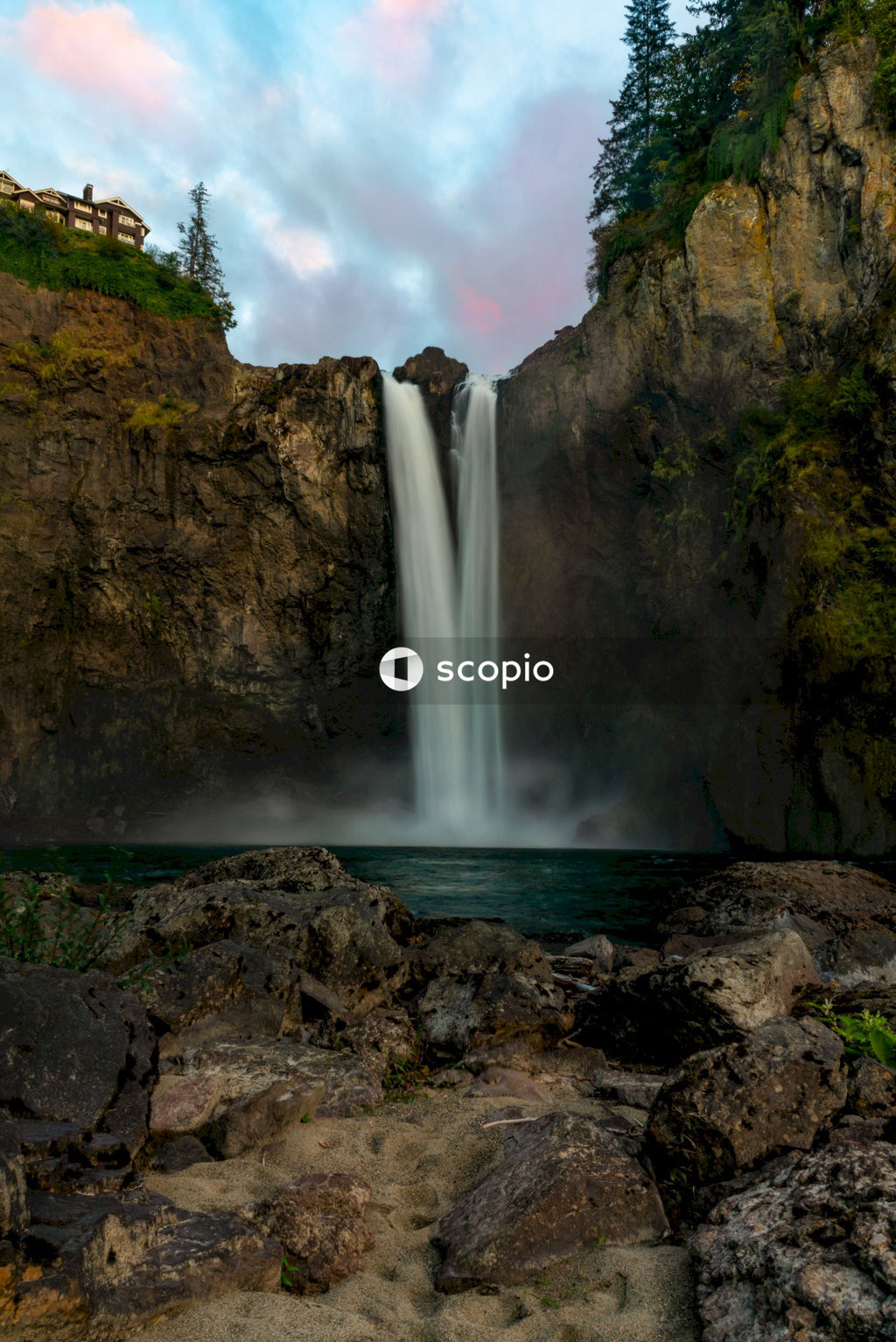 Waterfalls on brown rocky mountain