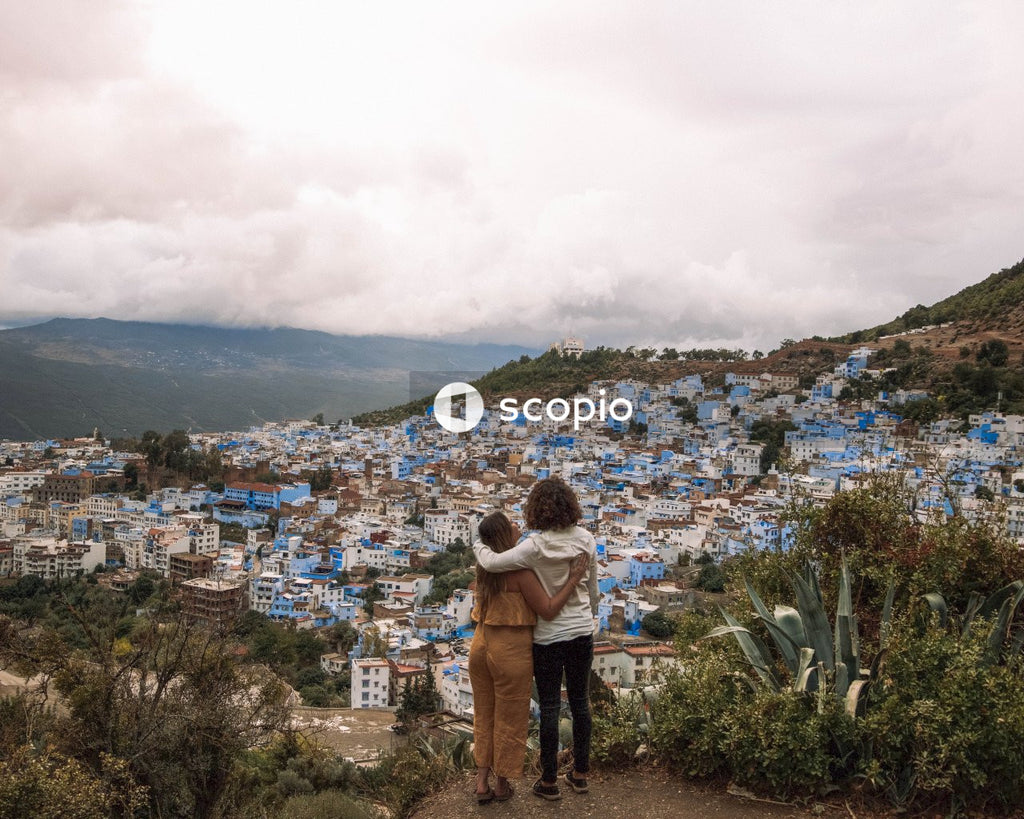 Man and woman standing in front on Chefchaouen, Morocco