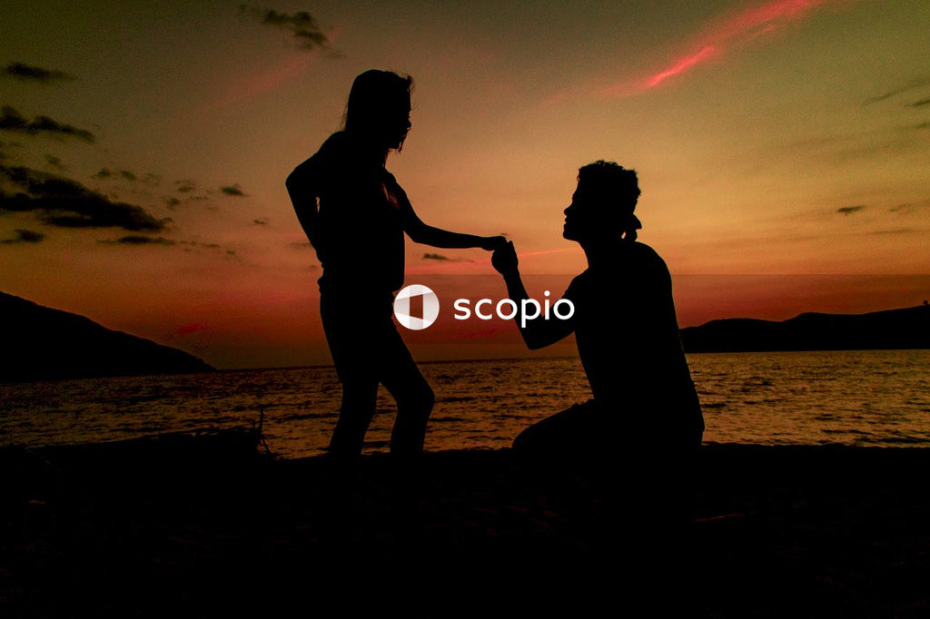 Man holding woman's hand
