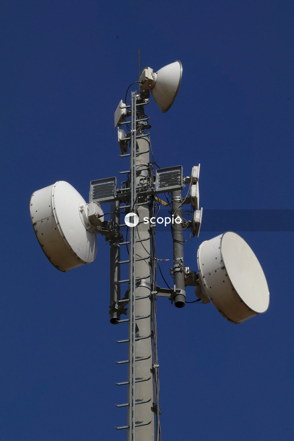 White signal tower in blue sky