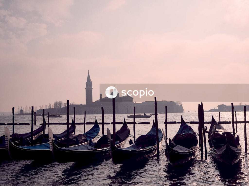 Boats on water near a city during sunset in Venice, Italy