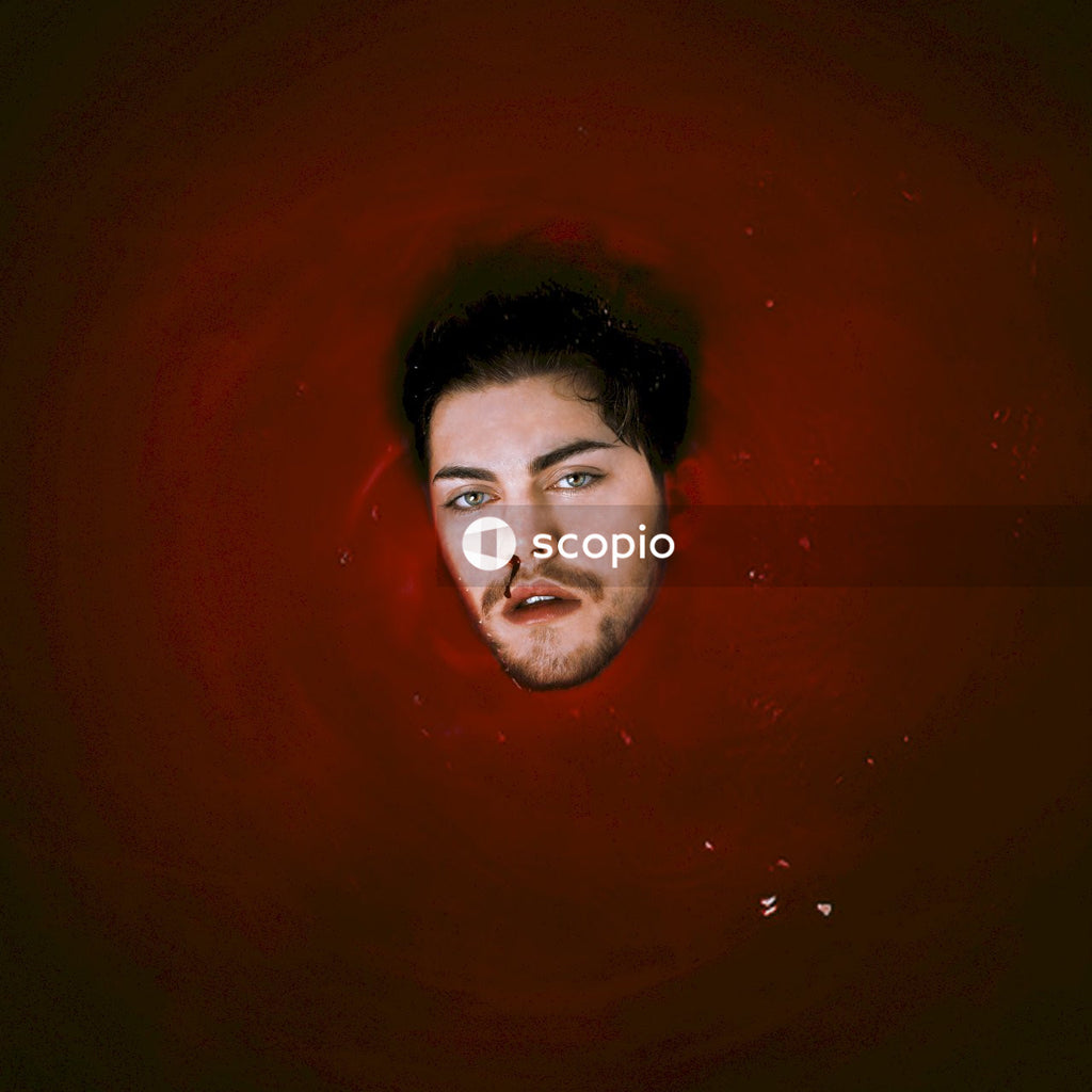 Face of man appearing in red water