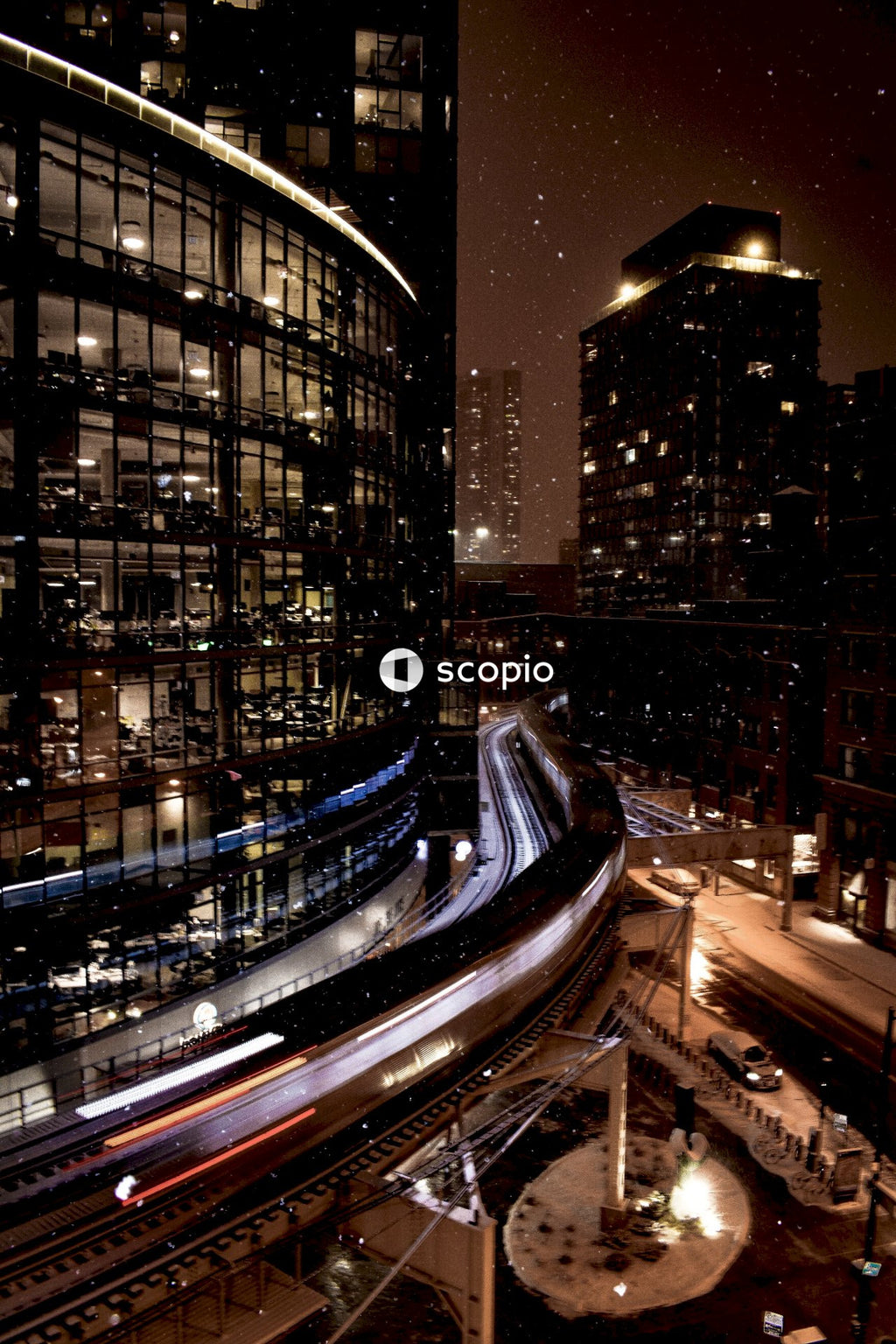 Long Exposure of Train Moving Through City at Night