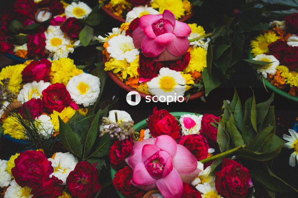 Pink and white flowers on brown wooden round tray