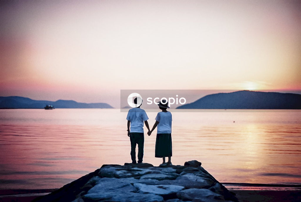 Couple Enjoying Sunset Serenity by the Lake