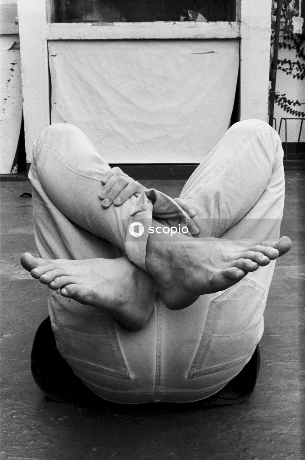 Person lying on the ground barefoot