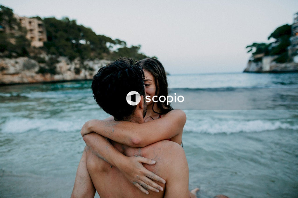 Man and woman hugging each other at the beach