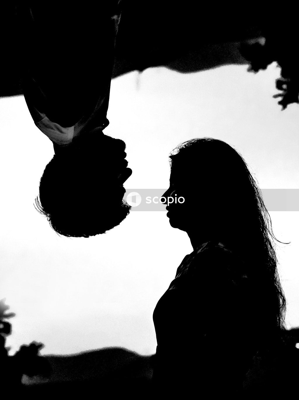 Grayscale photo of couple kissing