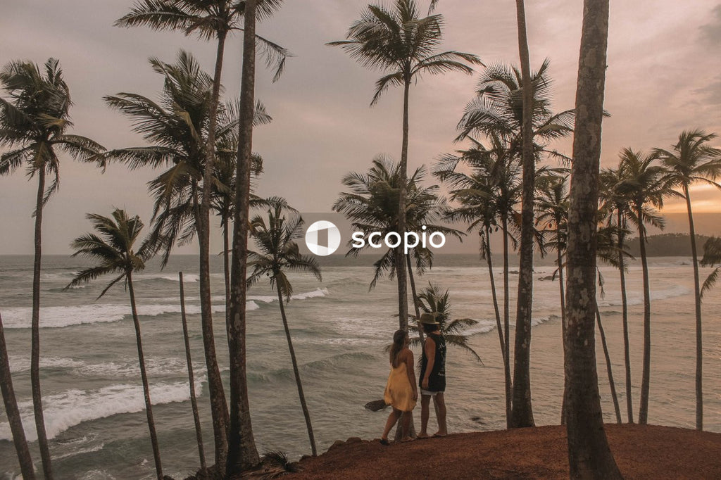 Man and woman standing on Mirissa Coconut Tree Hill, Sri Lanka