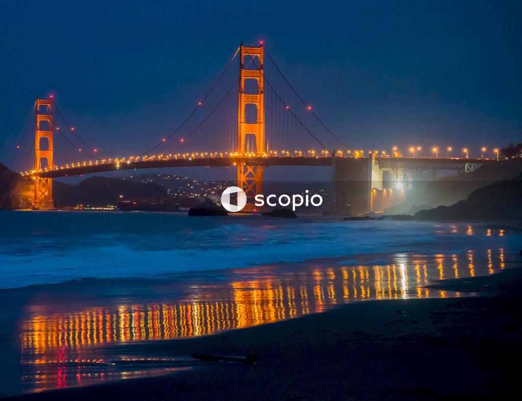 Night Shot of Golden Gate Bridge and City Skyline Reflected in Water