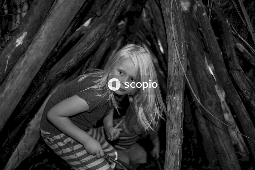 Grayscale photo of girl in t-shirt and striped skirt