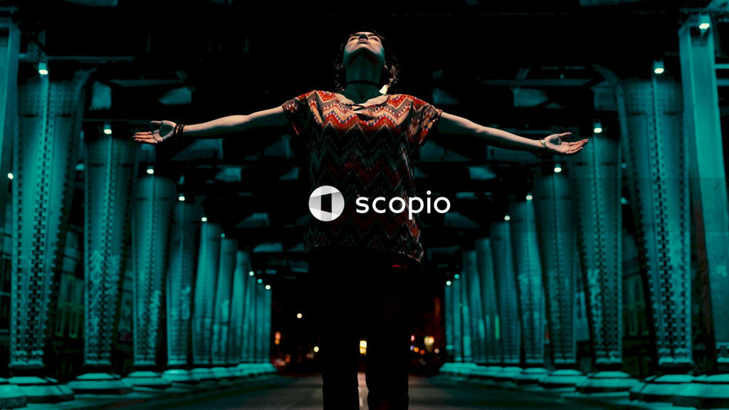 Woman standing and spreading her arms while looking upwards