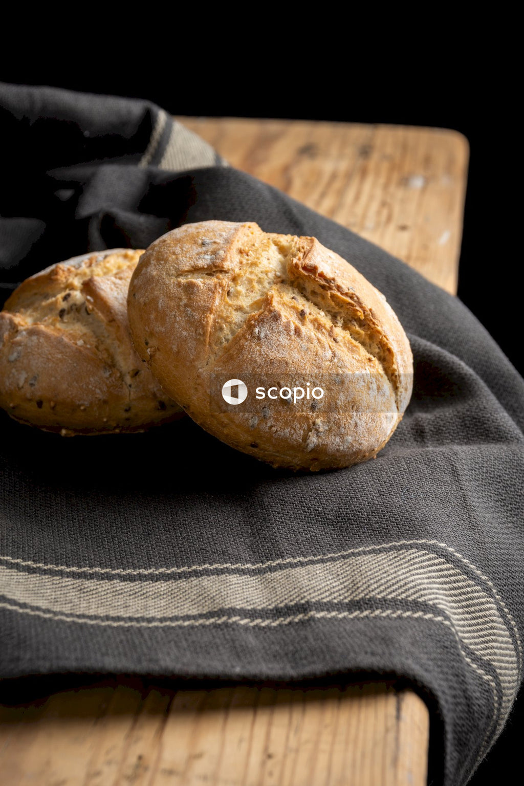 2 brown bread on black textile