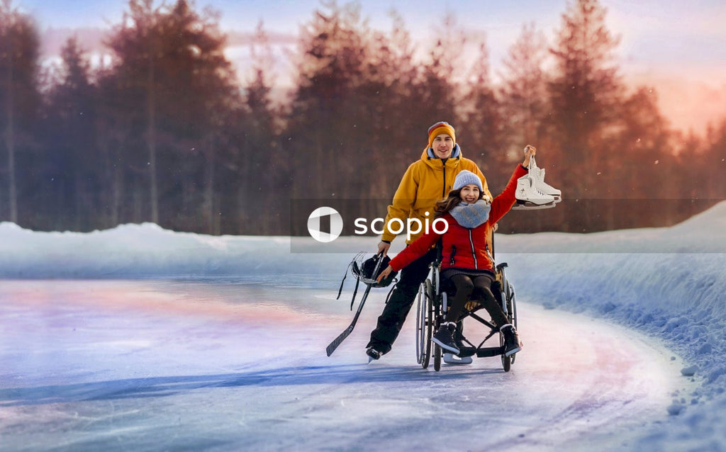 Man and a woman on wheelchair on frozen lake
