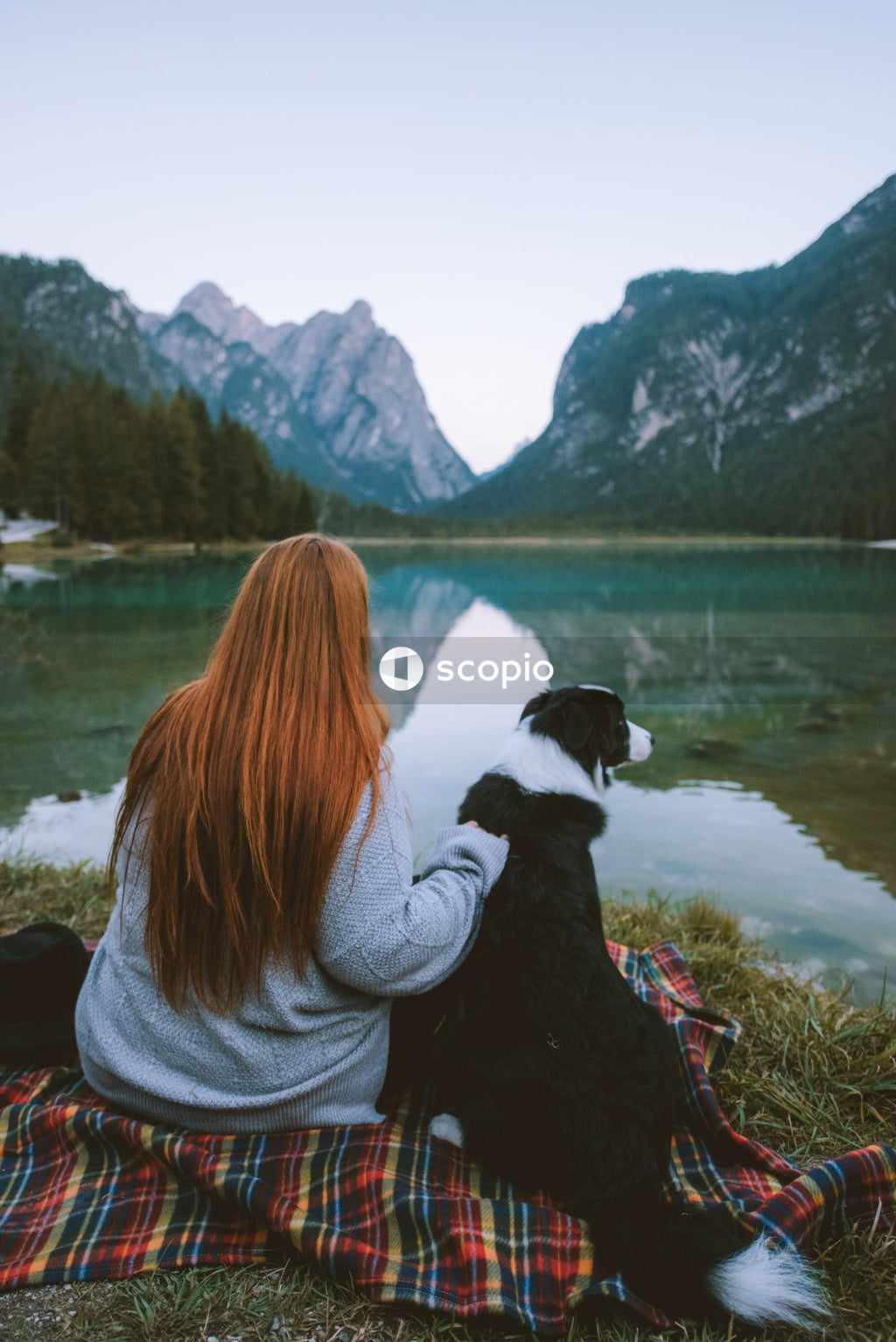Woman with dog at lake