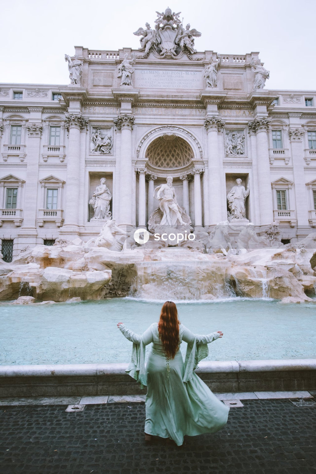 Woman in front of Trevi Fountain