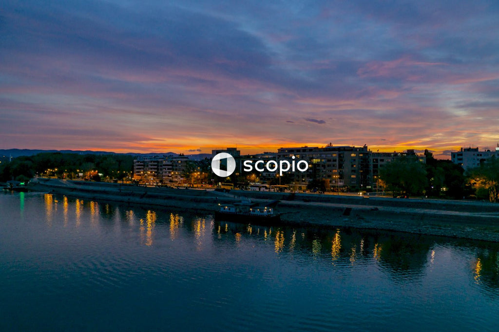 City skyline near body of water during night time