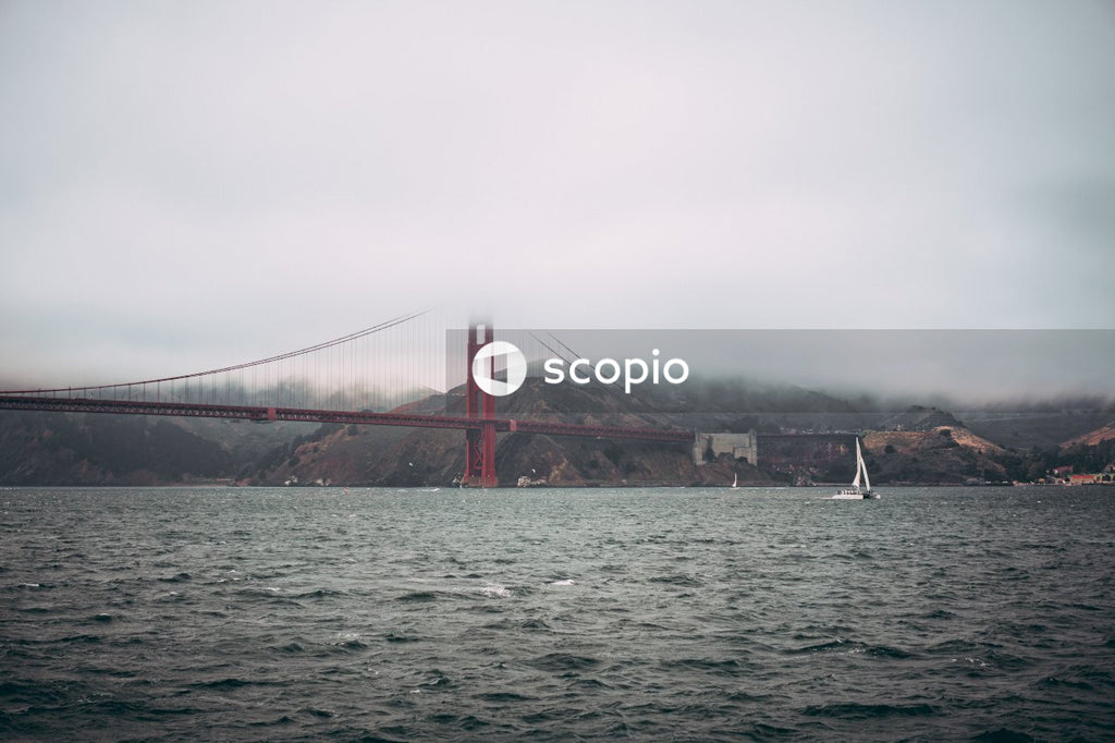 Iconic Red Suspension Bridge Over Golden Sea