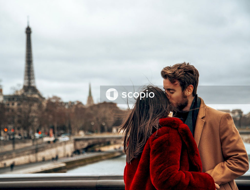 Man and woman kissing each other in Paris