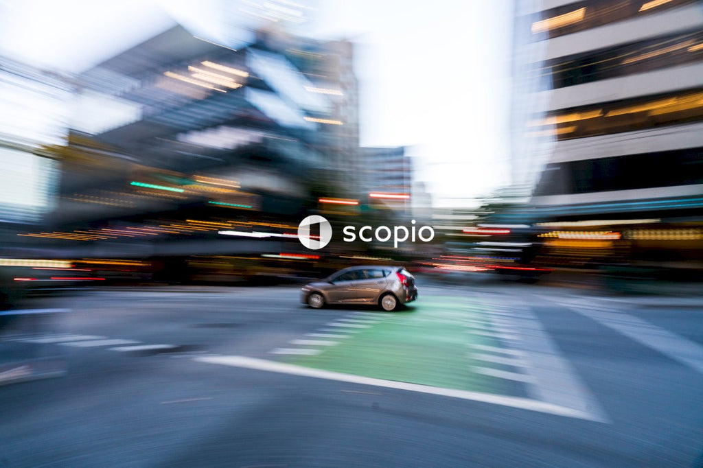 Time-lapse photo of car driving in city