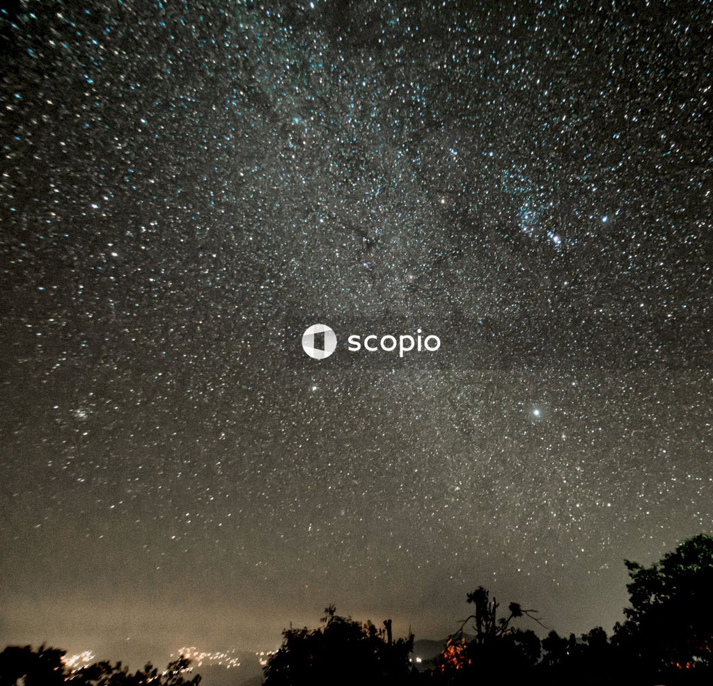 Silhouette of people under starry night