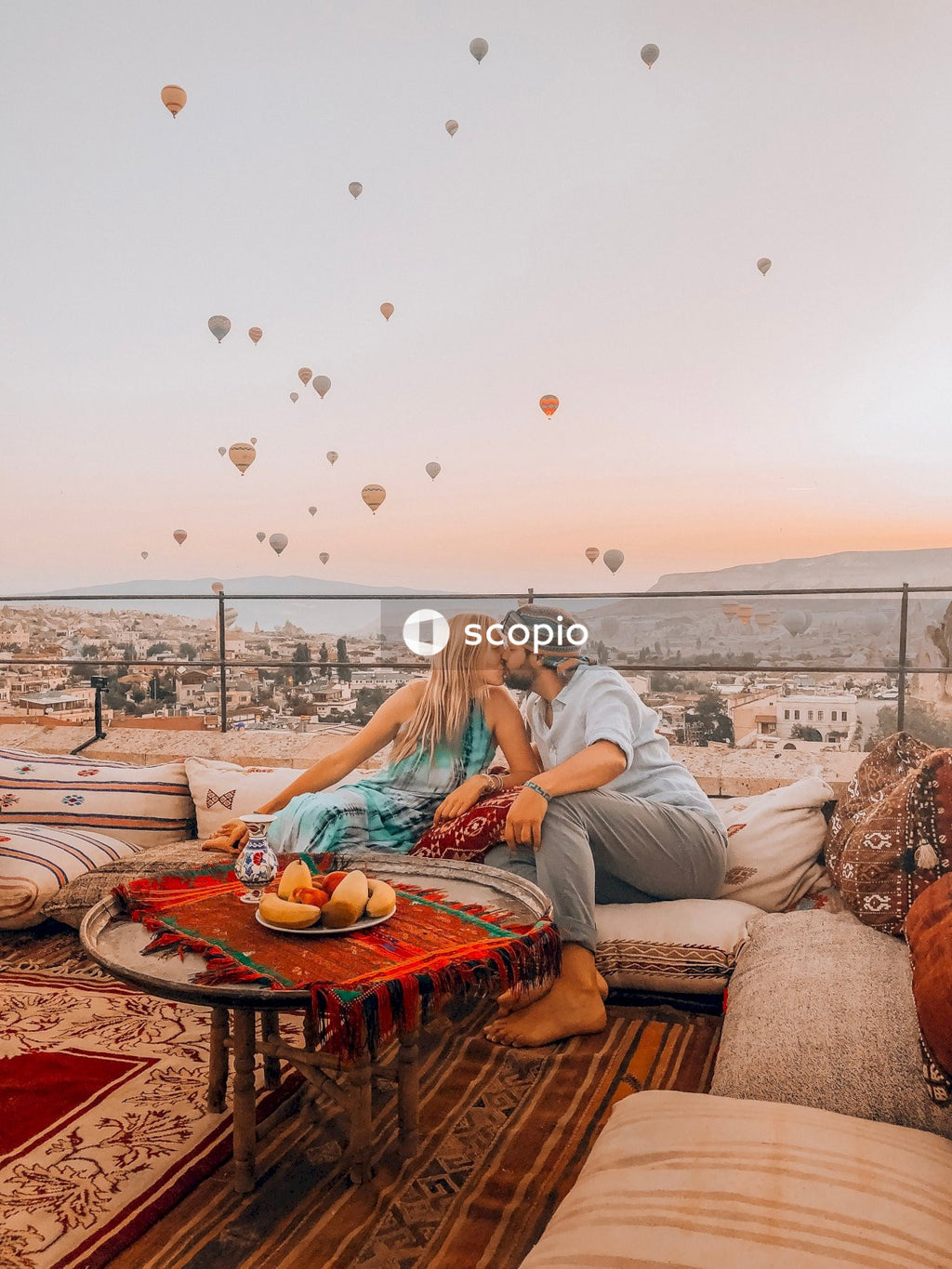 Couple kissing while sitting on sofa
