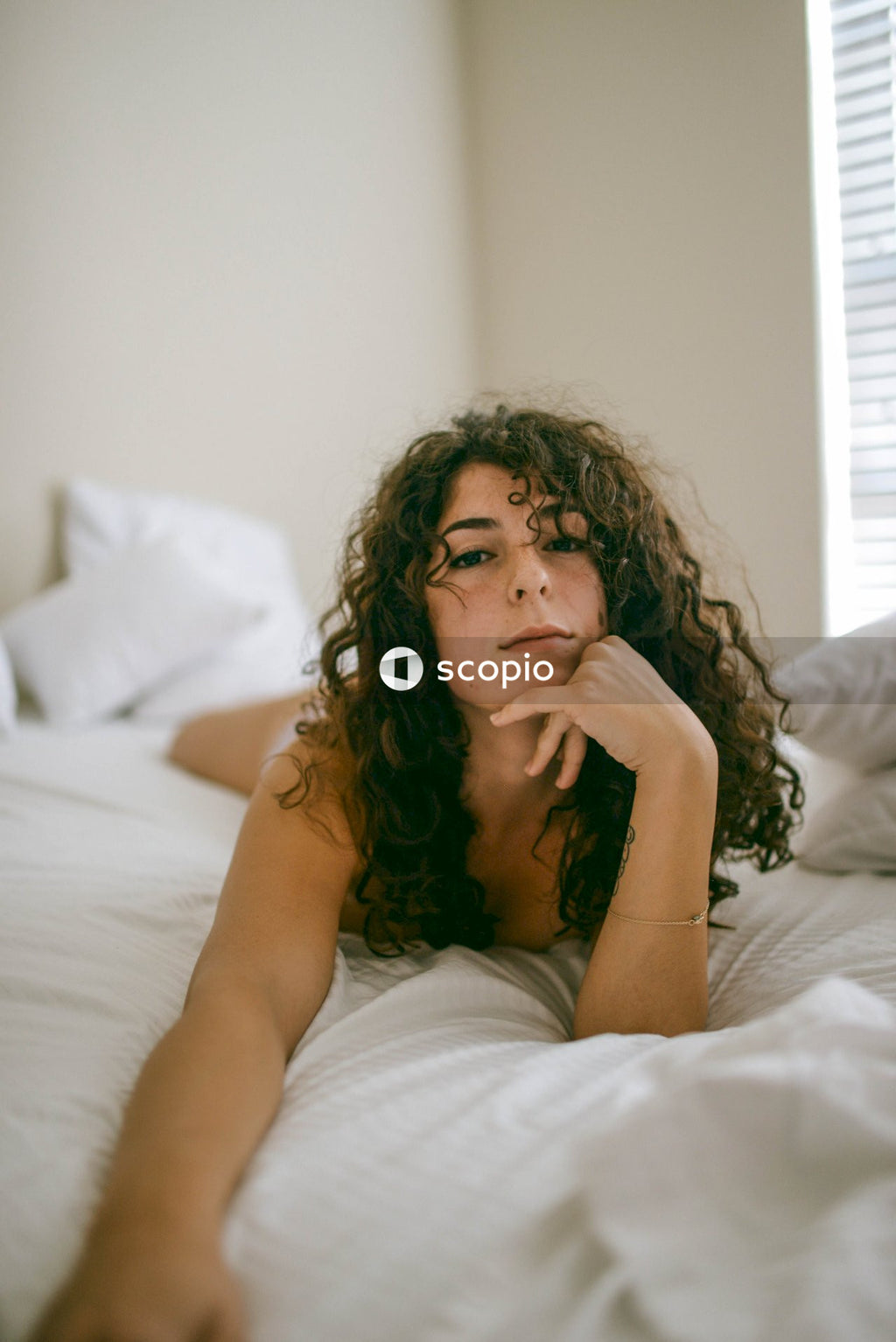 Woman lying on bed