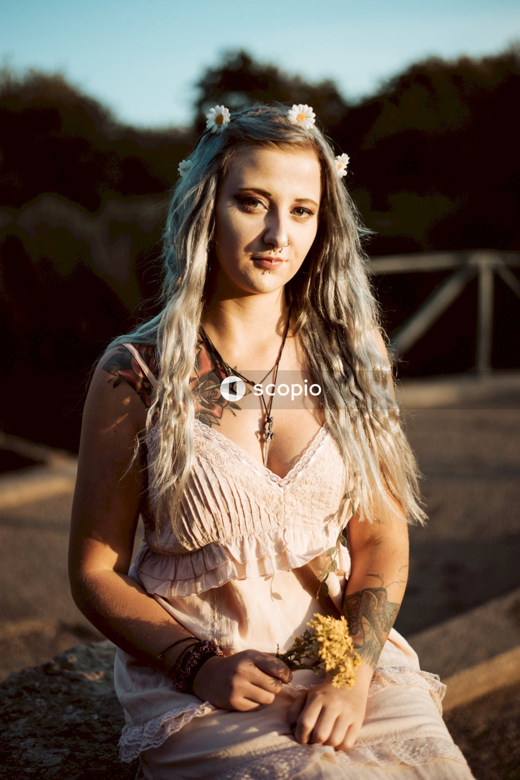 Woman in white lace sleeveless dress