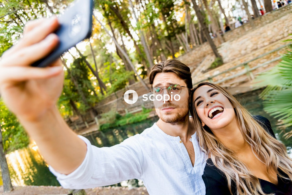 Couple taking selfie while smiling