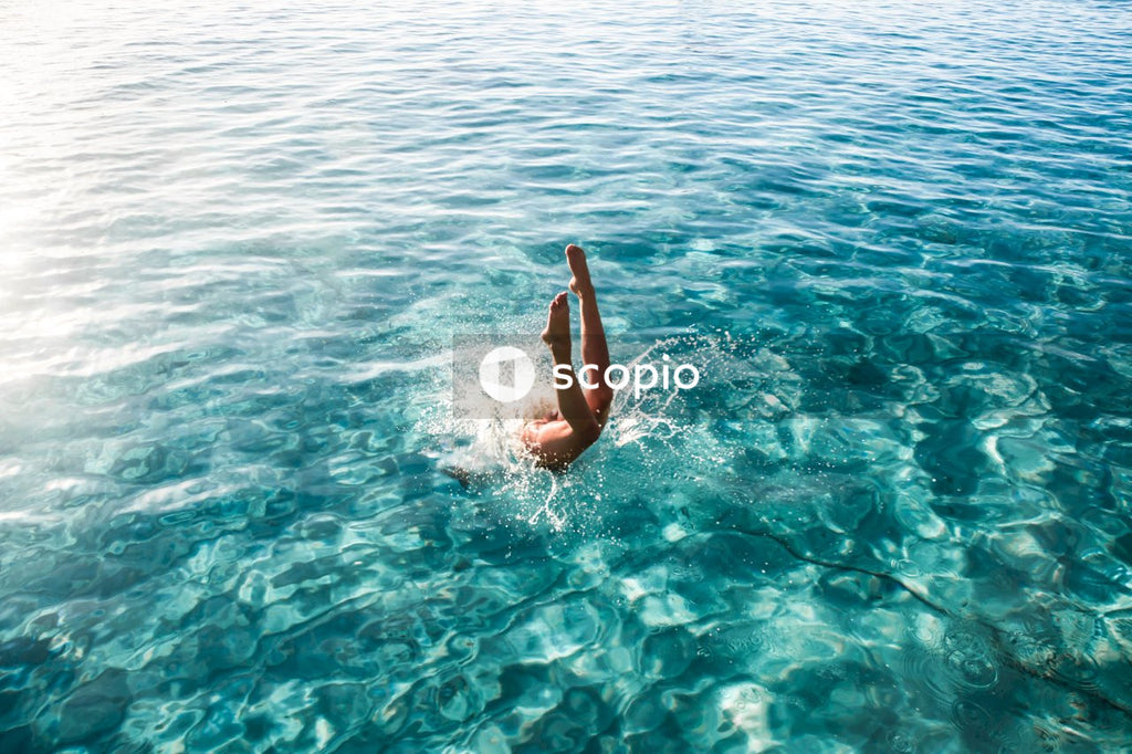 Woman diving into water