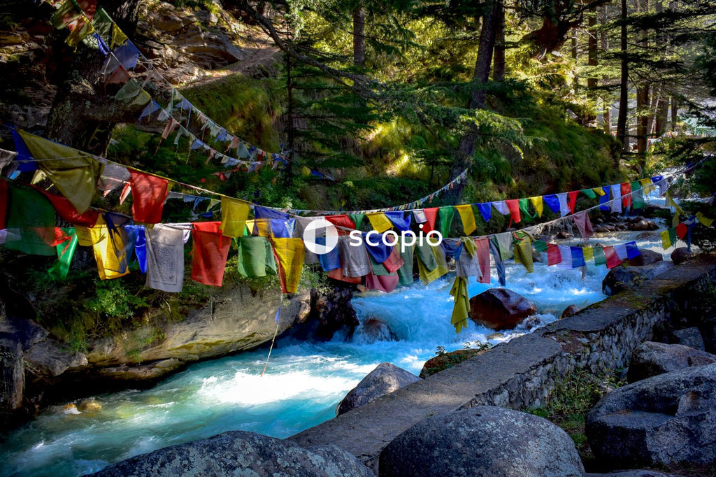 Multi colored textiles hanging on wire near river