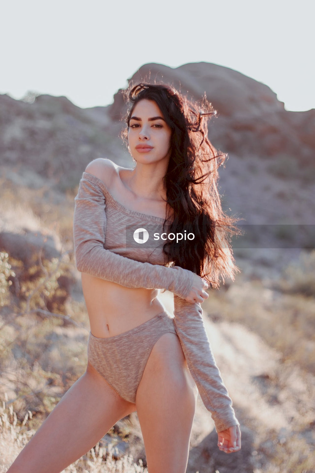 Woman in gray long sleeve shirt and white panty
