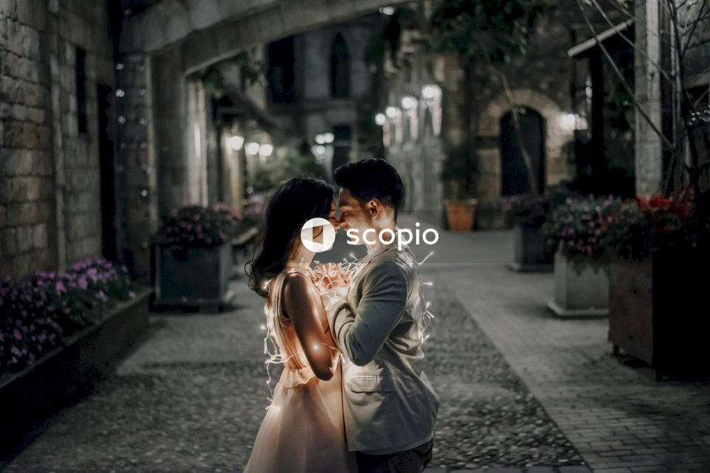 Man and woman kissing on street