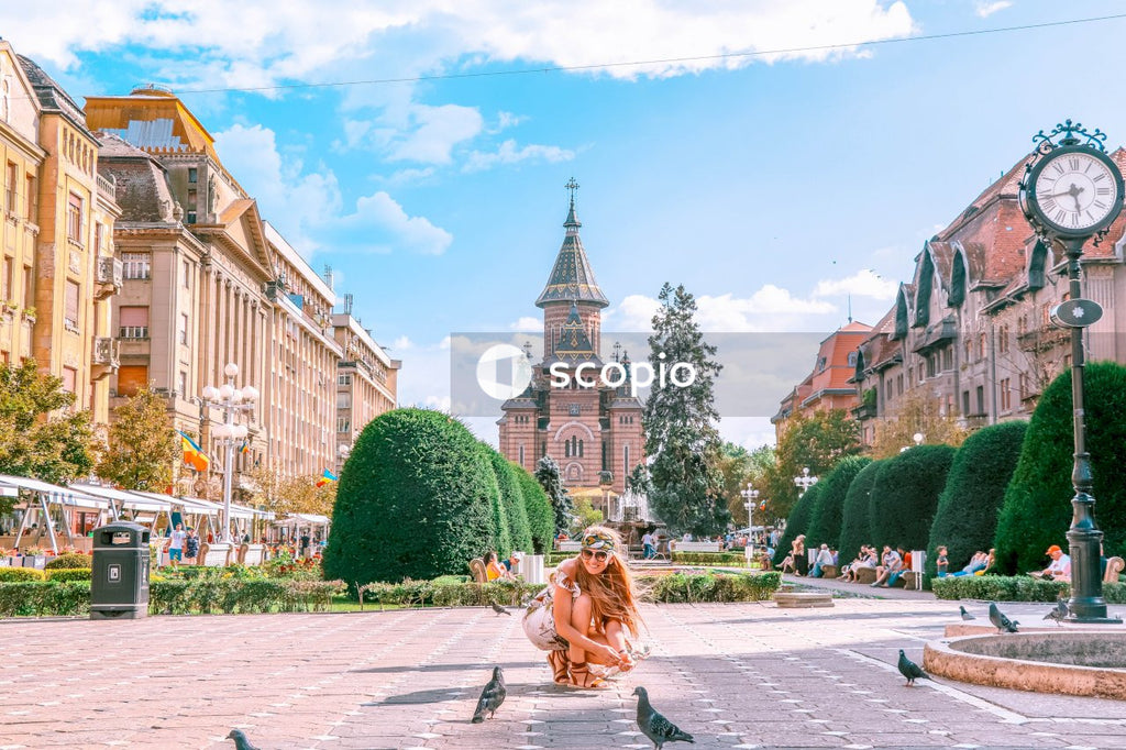 Woman feeding pigeons