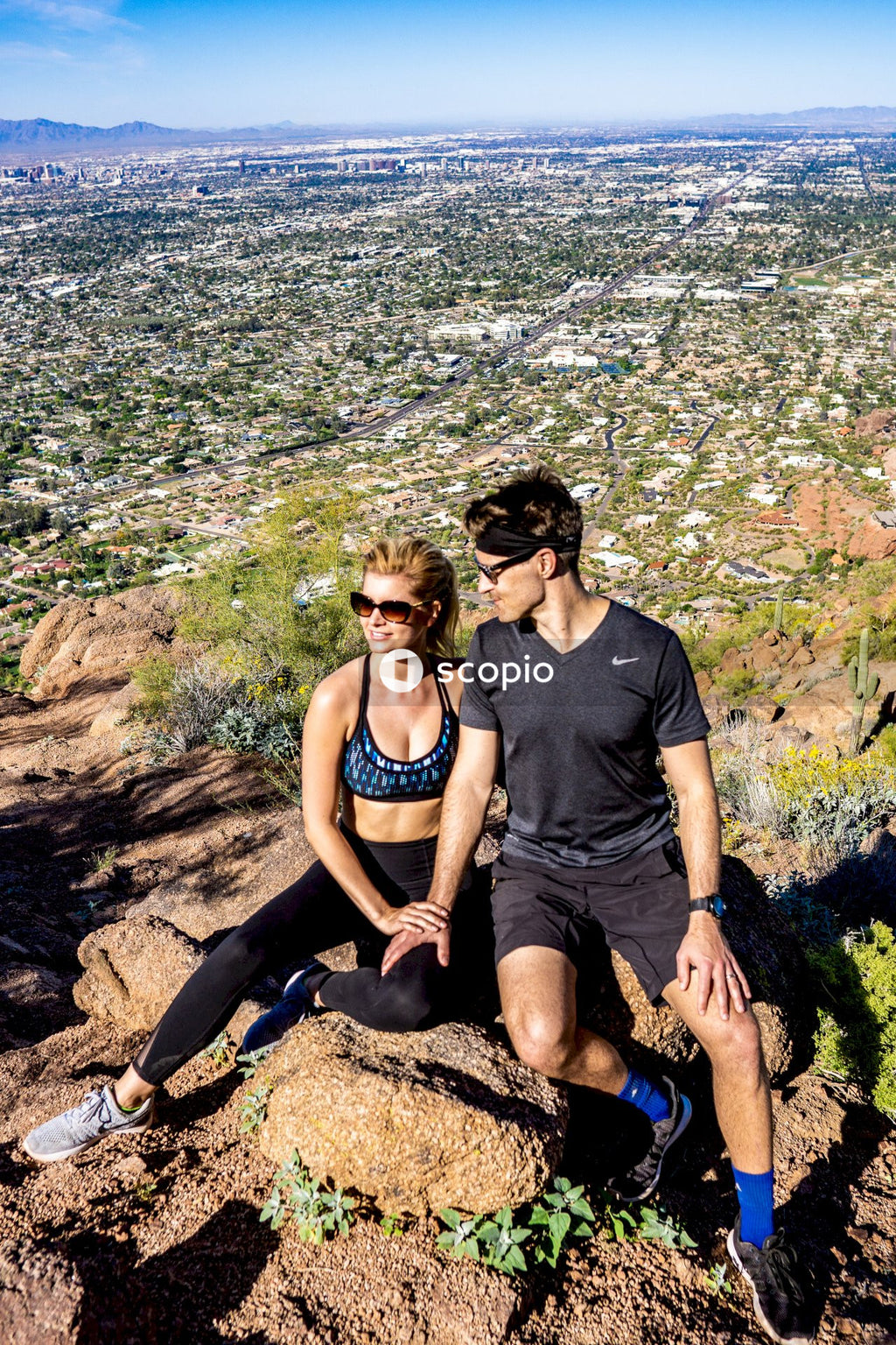 Couple sitting on rock