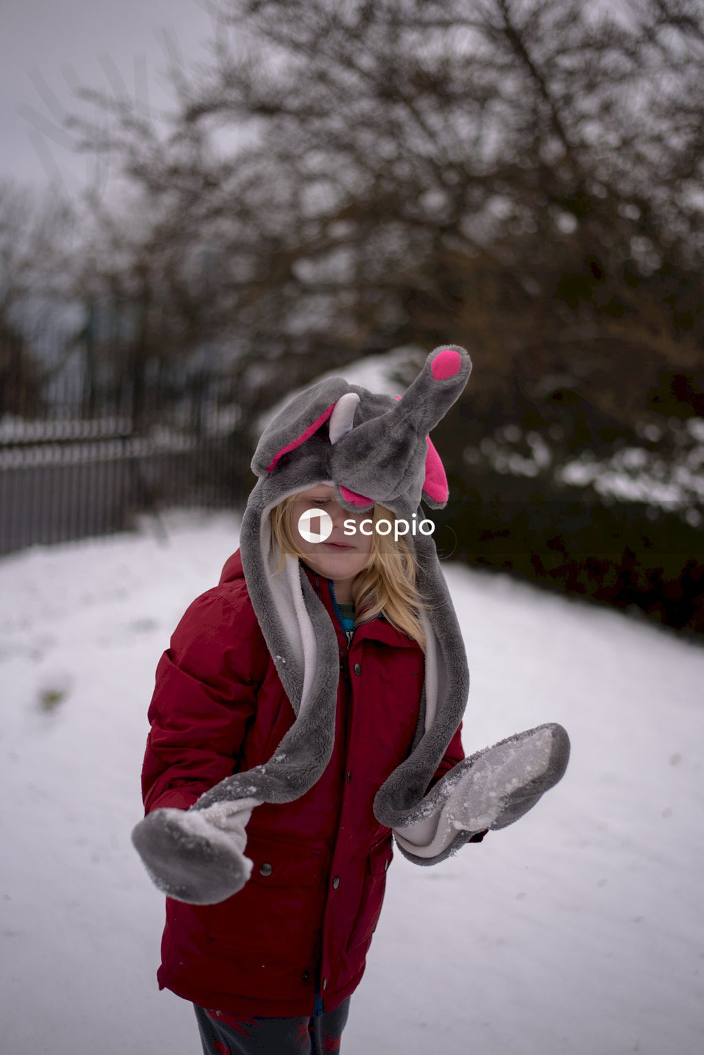 Cute Child in Elephant Hat Enjoying Snow