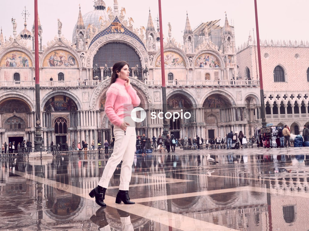 Woman standing in front of castle