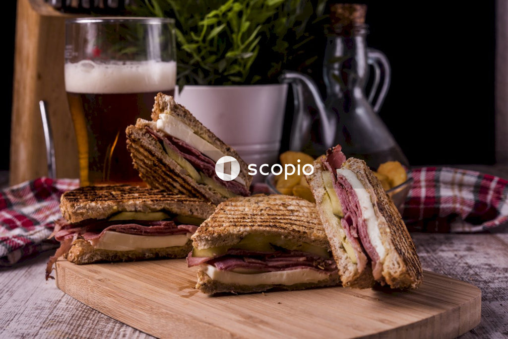Sliced bread on brown wooden chopping board
