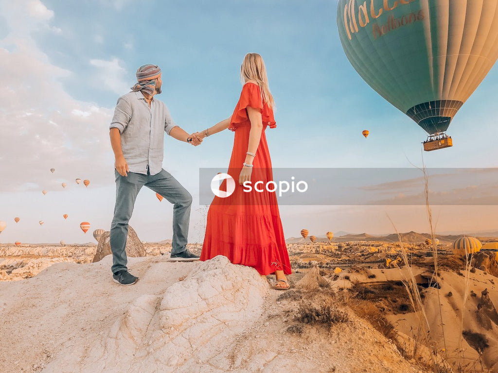 Couple holding hands at hot air balloon festival