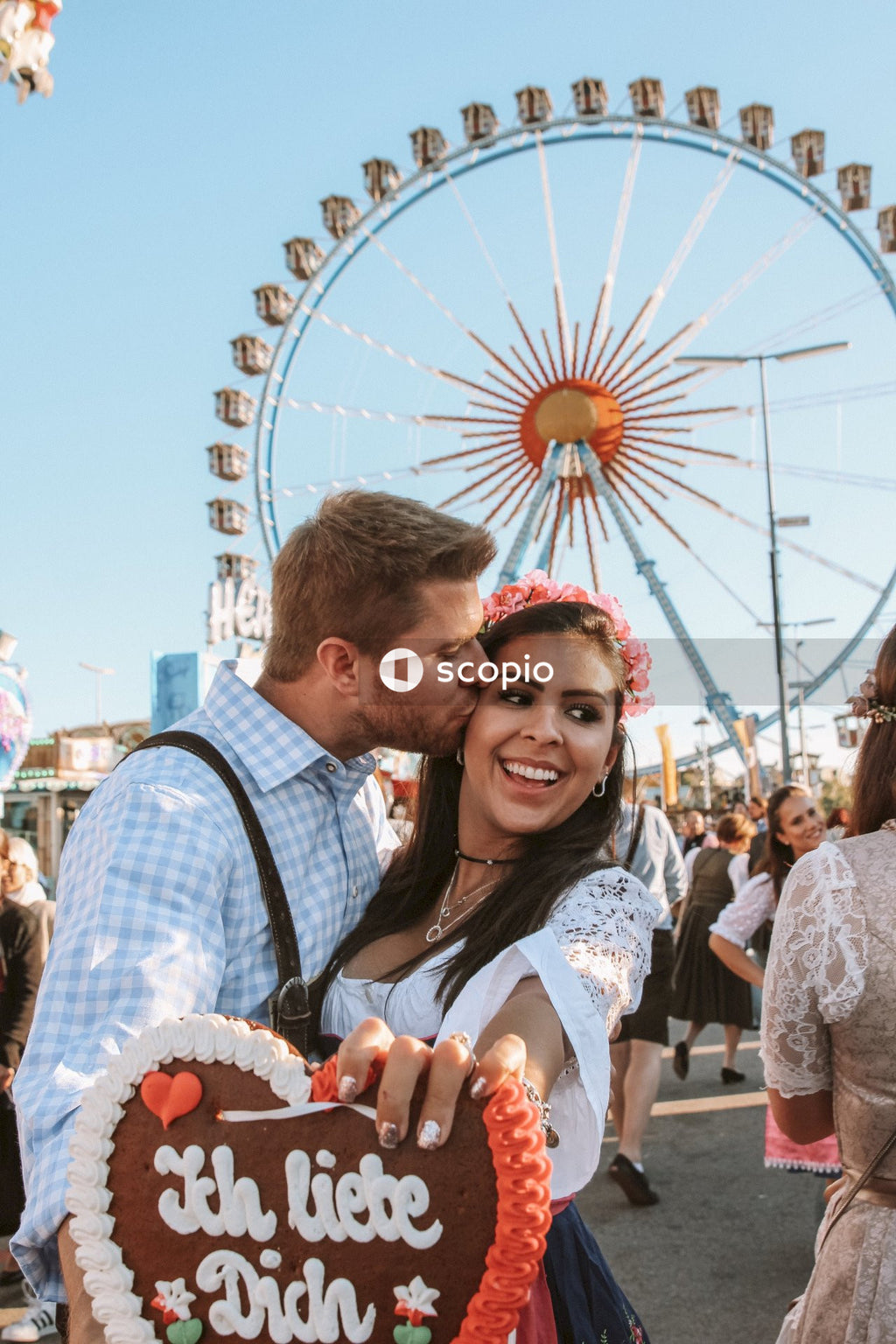 Man kissing woman during traditional festival