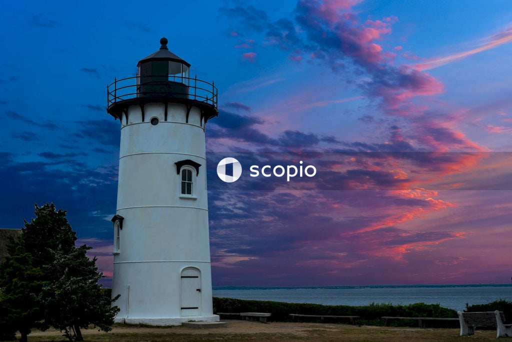 White and black lighthouse under blue sky