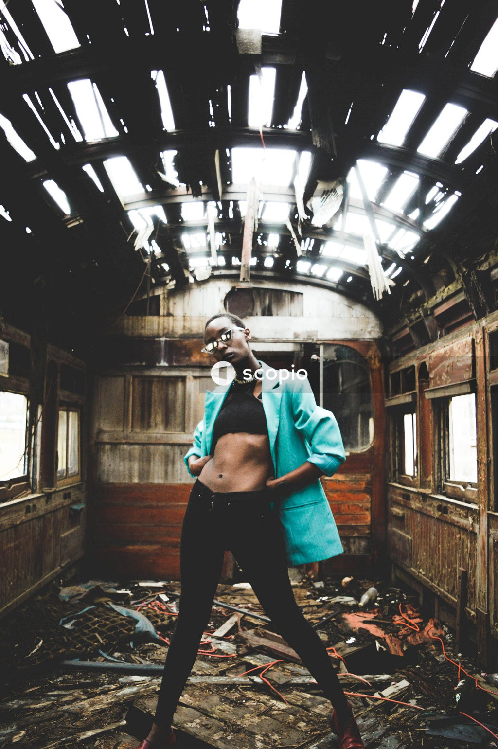 Woman standing inside wrecked train