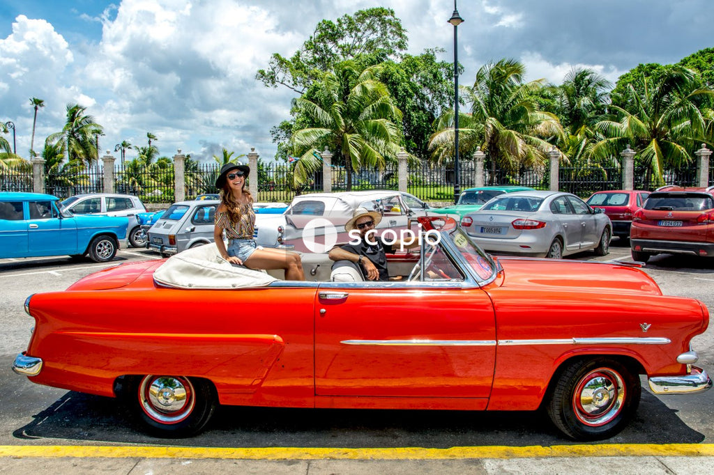 Couple in vintage convertible car
